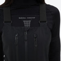 
                  
                    Breathable 3-layer ski bibs with cross-back straps - black, chest zip close-up detail, for resort and backcountry days
                  
                