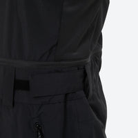 
                  
                    Unisex snowboard bib pants with snow gaiters - black, waist belt close-up detail, for skiing and snowboarding
                  
                