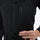 Breathable 3-layer ski bibs with cross-back straps - black, chest zip close-up with hand, for powder and piste riding