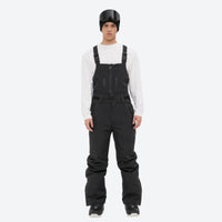 
                  
                    Men's breathable 3-layer suspender ski pants with pockets - black bib snow pants with white top, full-body front view
                  
                