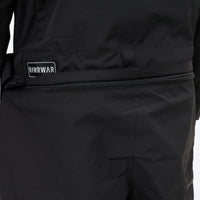 
                  
                    Unisex waterproof one-piece snow suit - black one-piece suit, waistband label close-up detail, for cold-weather winter sports
                  
                