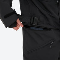 
                  
                    Unisex waterproof one-piece snow suit - black one-piece suit, waist belt close-up with hand, for skiing and snowboarding
                  
                