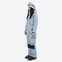 
                  
                    Unisex waterproof one-piece snow suit - ice blue one-piece suit, on-model side view, for powder and piste riding
                  
                