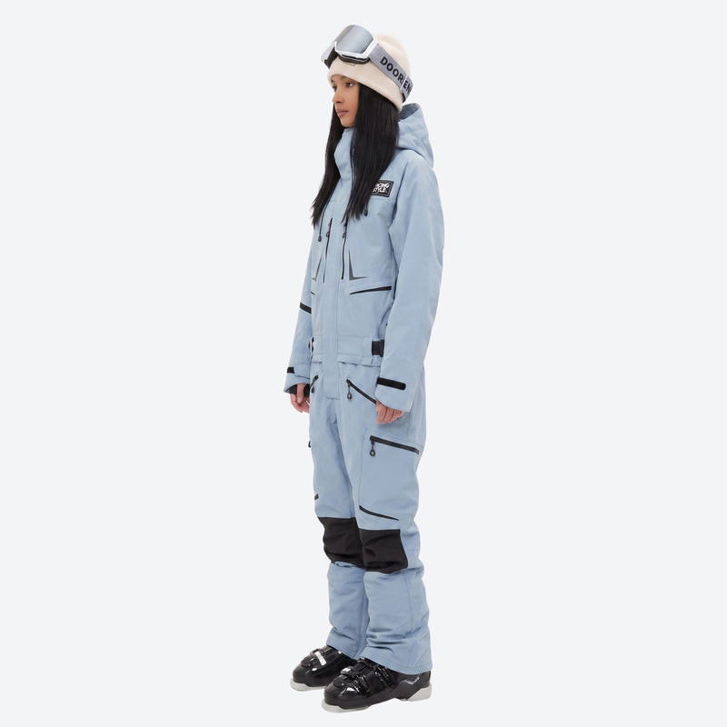 Unisex waterproof one-piece snow suit - ice blue one-piece suit, on-model side view, for powder and piste riding