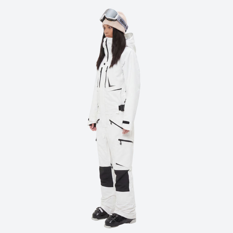 One-piece snowboard suit with knee reinforcement - white one-piece suit, on-model side view, for skiing and snowboarding