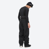 
                  
                    Men's 2-layer snowboard jacket and pants - black base layer top with black pants, for cold-weather winter sports
                  
                