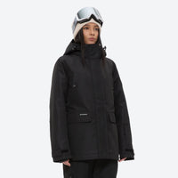 
                  
                    Women's waterproof 2L ski jacket and pants set - black, on-model three-quarter front view, for cold-weather winter sports
                  
                