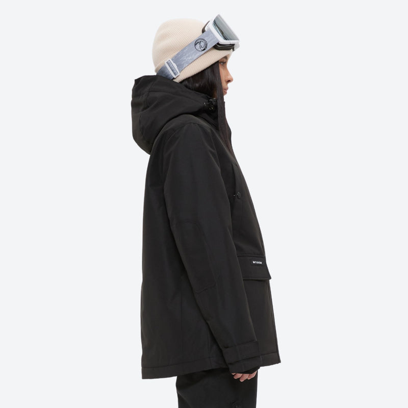 Women's breathable snow jacket with suspender pants - black, on-model hood side view, for snowy mountain travel