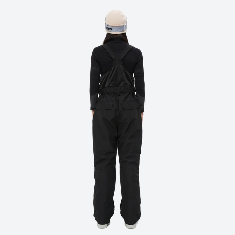 Women's 2-layer insulated ski suit - black snow pants, on-model back view, for cold-weather winter sports