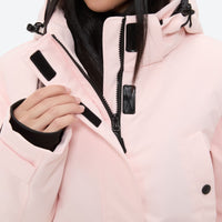 
                  
                    Women's waterproof 2L ski jacket and pants set - light pink, chest zip close-up with hand, for skiing and snowboarding
                  
                