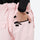 Women's 2-layer insulated ski suit - light pink snow pants, back pocket close-up with hand, for snowy mountain travel