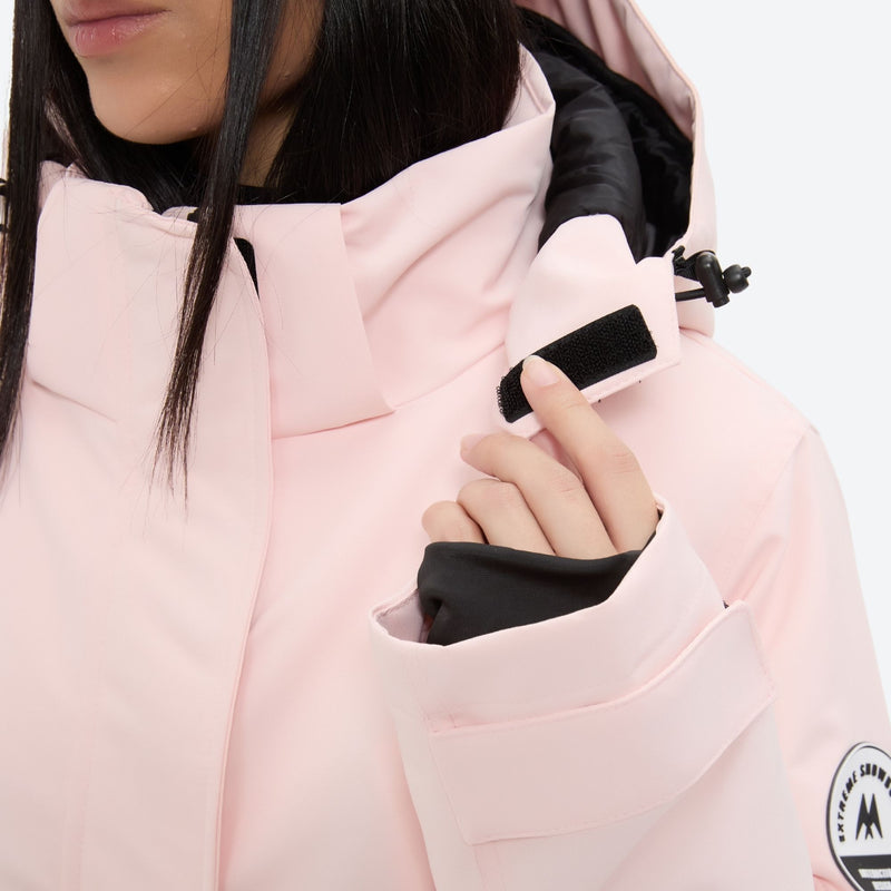 Women's 2-layer insulated ski suit - light pink, collar close-up with hand, for snowy mountain travel