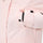 Women's 2-layer insulated ski suit - light pink, side pocket snap close-up with hand, for cold-weather winter sports