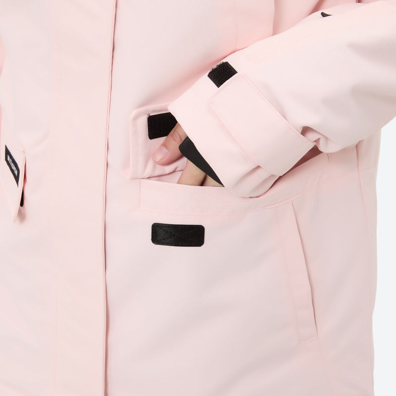 Women's waterproof 2L ski jacket and pants set - light pink, sleeve pocket close-up with hand, for skiing and snowboarding