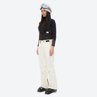 
                  
                    Women's breathable snow jacket with suspender pants - cream snow pants, on-model side view, for resort and cross-country days
                  
                