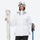 Women's 3-layer breathable ski suit - white, front with upright skis and poles, for cold-weather winter sports