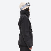 
                  
                    Women's waterproof 3L ski jacket and pants set - black, on-model side view, for cold-weather winter sports
                  
                