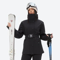 
                  
                    Women's waterproof 3L ski jacket and pants set - black, front with upright skis and poles, for resort and cross-country days
                  
                