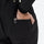 Women's waterproof 3L snow jacket and bib pants - black, side pocket close-up with hand, for skiing and snowboarding