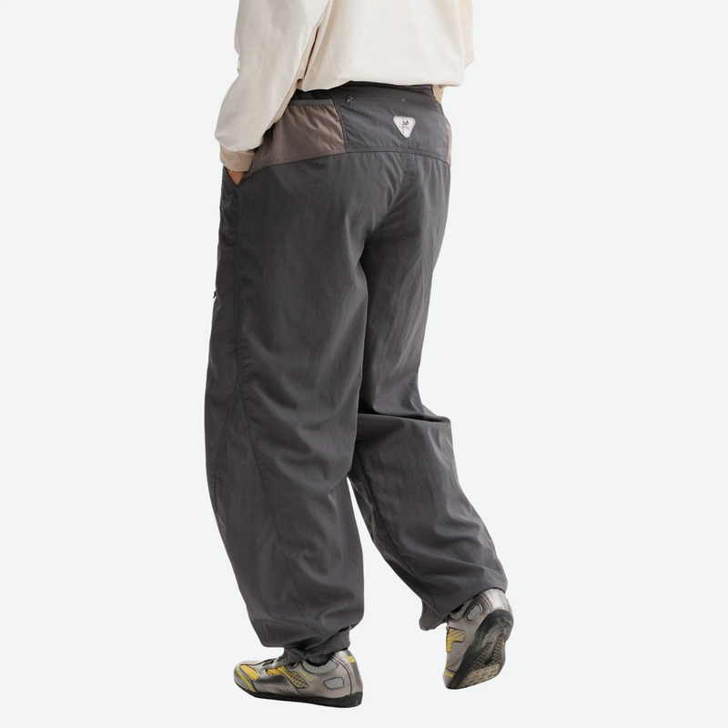 Unisex parachute hiking pants with hidden pockets - dark gray hiking pants, back walking view, for daily outdoor wear