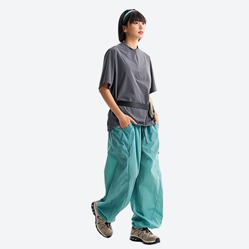 Breathable loose-fit trail pants with mesh lining - teal hiking pants with gray tee, for hiking and trail walking