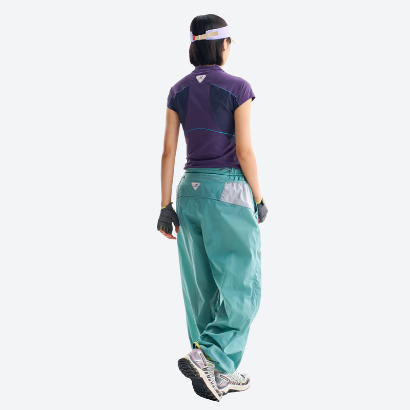 Unisex lightweight quick-dry hiking pants - teal hiking pants with purple tee, back walking view, for daily outdoor wear