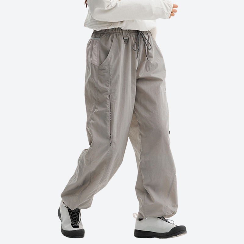 Unisex parachute hiking pants with hidden pockets - light gray hiking pants with white top, for warm-weather adventures