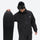Men's 2-layer snowboard jacket and pants - black jacket, on-model front holding snowboard, for powder days and winter commute
