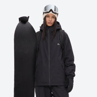 
                  
                    Unisex waterproof 2L snow jacket and pants - black jacket, on-model front with upright snowboard, for skiing and snowboarding
                  
                