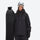 Unisex waterproof 2L snow jacket and pants - black jacket, on-model front with upright snowboard, for skiing and snowboarding