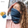 Warm merino neckwarmer for winter sports - teal merino wool neckwarmer on women with merino label, for winter mountain trips