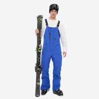 
                  
                    Men's minimalist bib snowboard pants with gaiters - blue bib snow pants, for powder and piste riding
                  
                