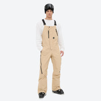 
                  
                    Men's breathable 3-layer suspender ski pants - tan bib snow pants with white top, for resort and backcountry days
                  
                