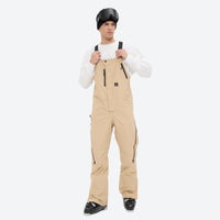 
                  
                    Men's minimalist bib snowboard pants with gaiters - tan bib snow pants, for powder and piste riding
                  
                