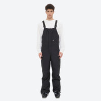 
                  
                    Men's breathable 3-layer suspender ski pants - black bib snow pants with white top, for cold-weather winter sports
                  
                