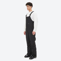 
                  
                    Men's minimalist bib snowboard pants with gaiters - black bib snow pants with white top, for skiing and snowboarding
                  
                