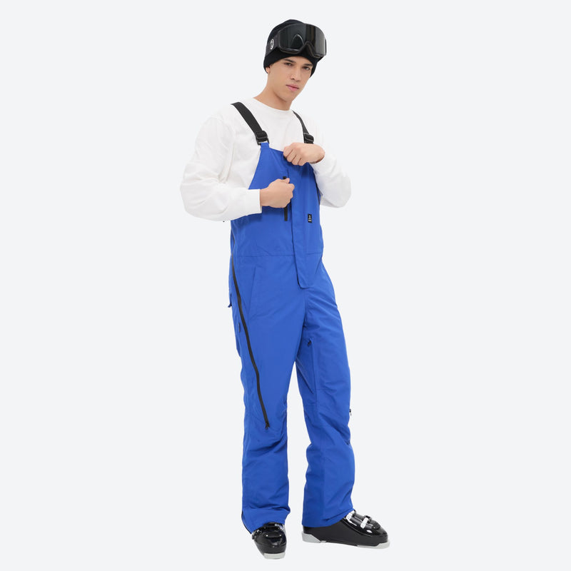 Men's waterproof 3L bib snow pants - blue bib snow pants, front view with hand at chest, for resort and backcountry days
