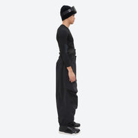 
                  
                    Men's 3-layer snowboard pants with jacket - black snow pants with black top, on-model side view, for skiing and snowboarding
                  
                