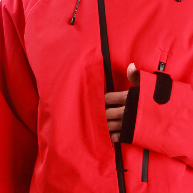 Men's waterproof 3L snow pants and jacket series - red, chest pocket close-up with hand, for powder days and winter commute