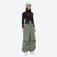
                  
                    Women's 3-layer snowboard pants with jacket - sage green snow pants with black top, for cold-weather winter sports
                  
                