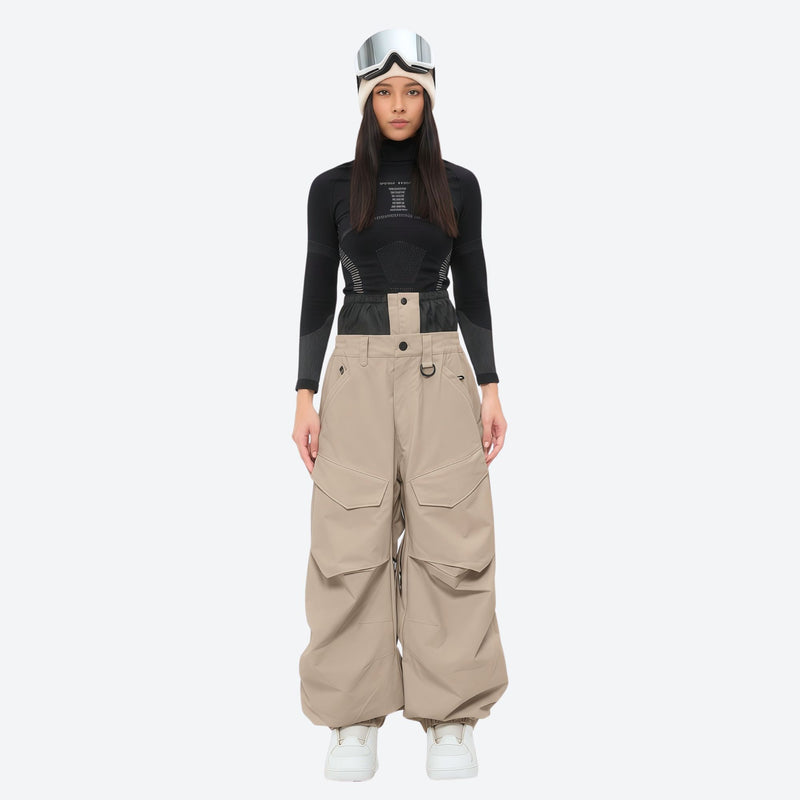 Women's 3-layer snowboard pants with jacket - tan snow pants with black top, on-model front view, for resort and street wear