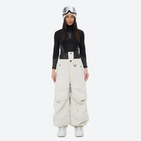 
                  
                    Women's waterproof 3L snow pants and jacket series - white snow pants with black top, for powder days and winter commute
                  
                