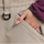 Women's breathable balloon snow pants set - tan snow pants, waist pocket close-up with hand, for cold-weather winter sports