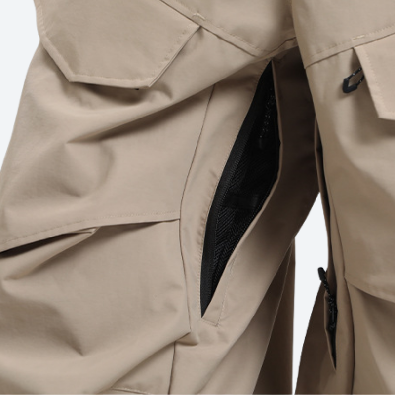 Men's 3-layer snowboard pants with jacket - tan snow pants, thigh zip vent close-up detail, for resort and street wear
