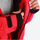 Women's breathable balloon snow pants set - red, interior lining close-up with hand, for powder days and winter commute