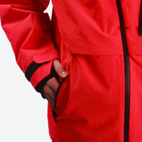 
                  
                    Men's breathable balloon snow pants set - red, side pocket close-up with hand, for cold-weather winter sports
                  
                