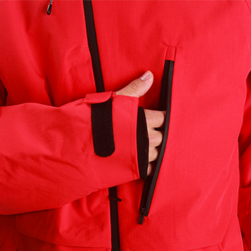 Women's breathable balloon snow pants set - red, side pocket close-up with hand, for cold-weather winter sports