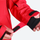 Women's breathable balloon snow pants set - red, cuff strap close-up with hand, for resort and street wear