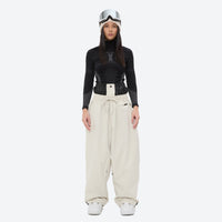 
                  
                    Women's waterproof 2L snow jacket and pants - cream snow pants, on-model front view, for powder days and winter commute
                  
                