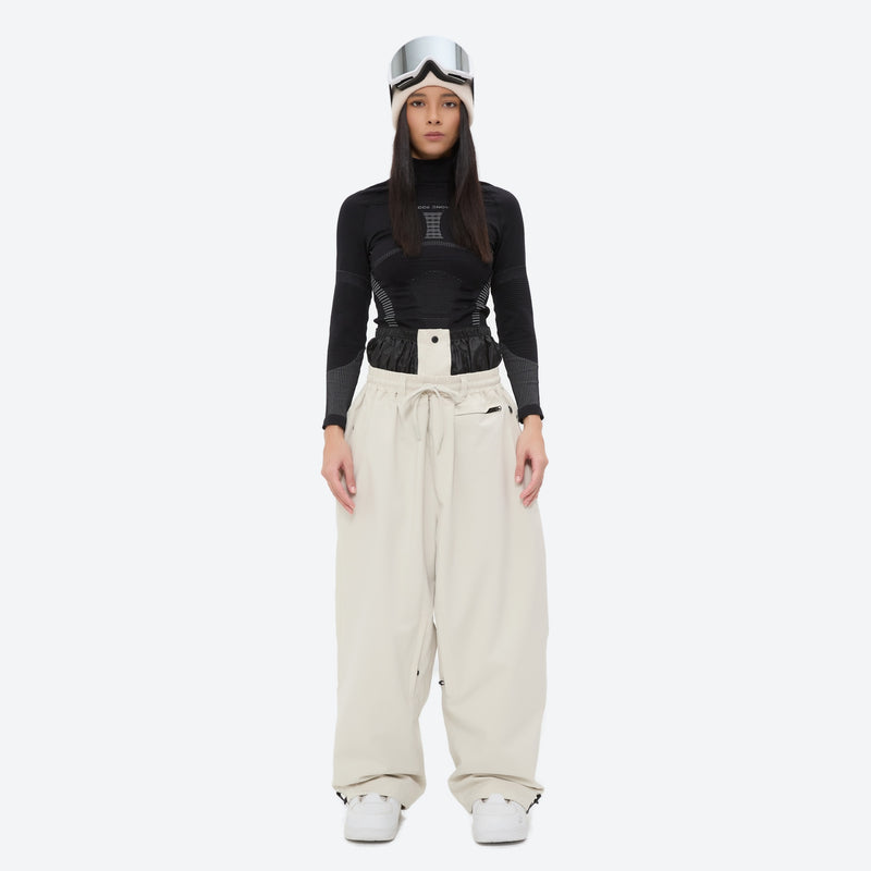 Women's waterproof 2L snow jacket and pants - cream snow pants, on-model front view, for powder days and winter commute
